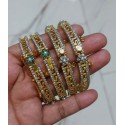 Elegant Gold-Plated Bangles Studded with Ruby Stones