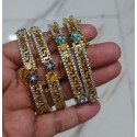 Elegant Gold-Plated Bangles Studded with Ruby Stones