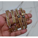 Elegant Gold-Plated Bangles Studded with Ruby Stones